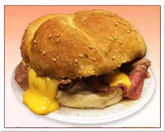 a sandwich with cheese on top